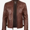 Front view of a men’s vintage brown biker leather jacket featuring quilted shoulders and zippered pockets
